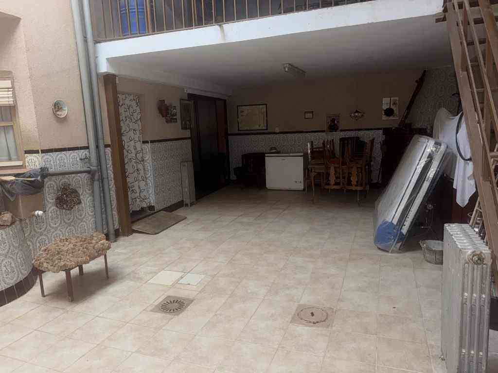casa con cochera y patio cubierto